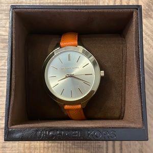 Authentic Michael Kors orange slim band watch